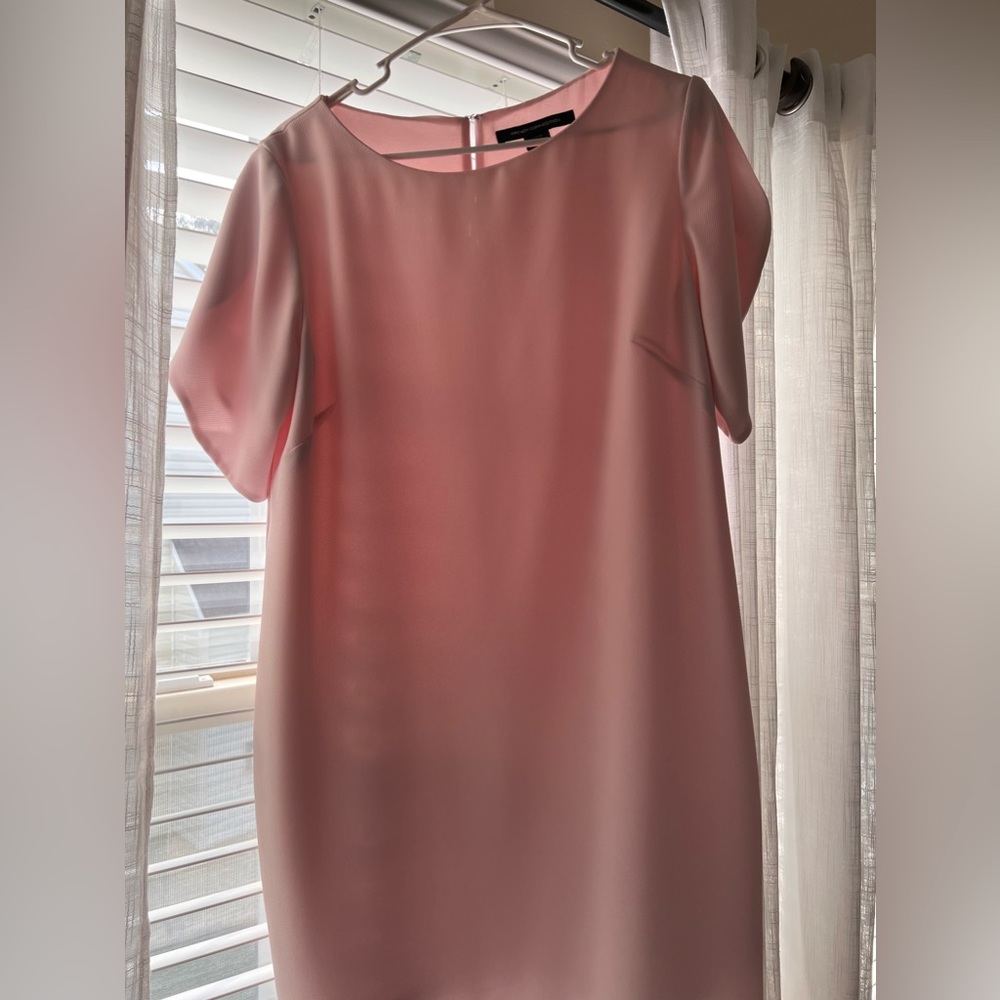 Knee length light and pink dress. Used only 2 times.